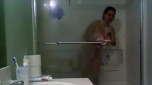 Girl in glass taking a shower