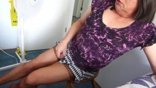 Sitting on my Treasure in a short skirt and Tan Stockings